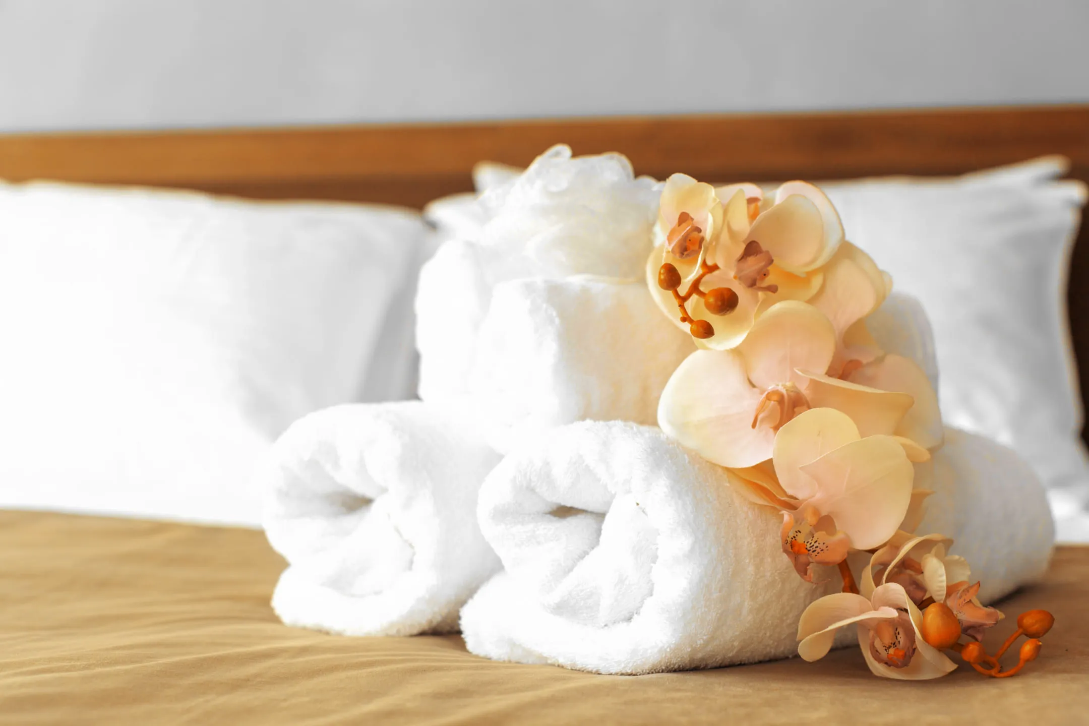 Towels neatly folded on the bed