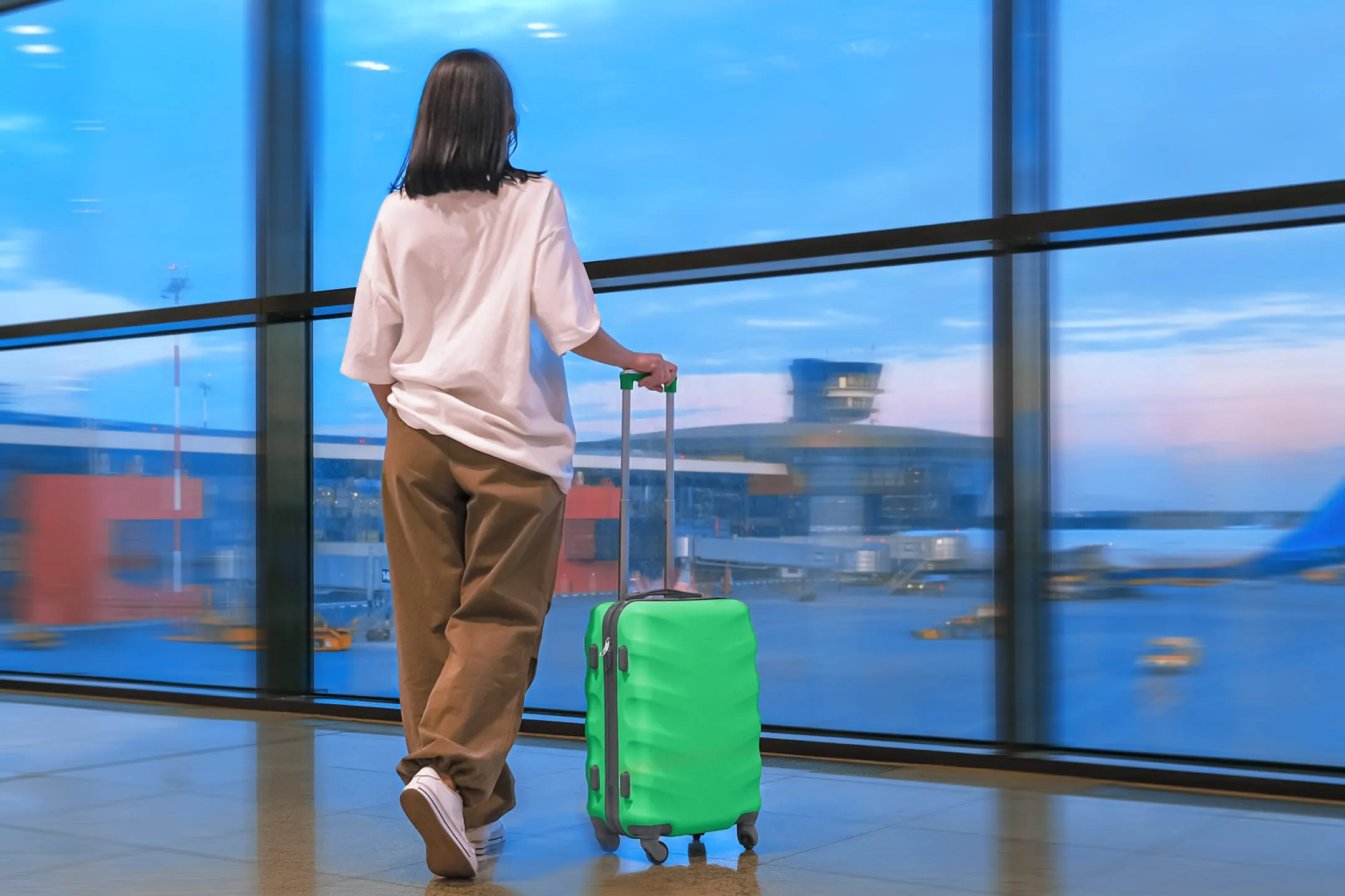 Girl with a suitcase at the airport