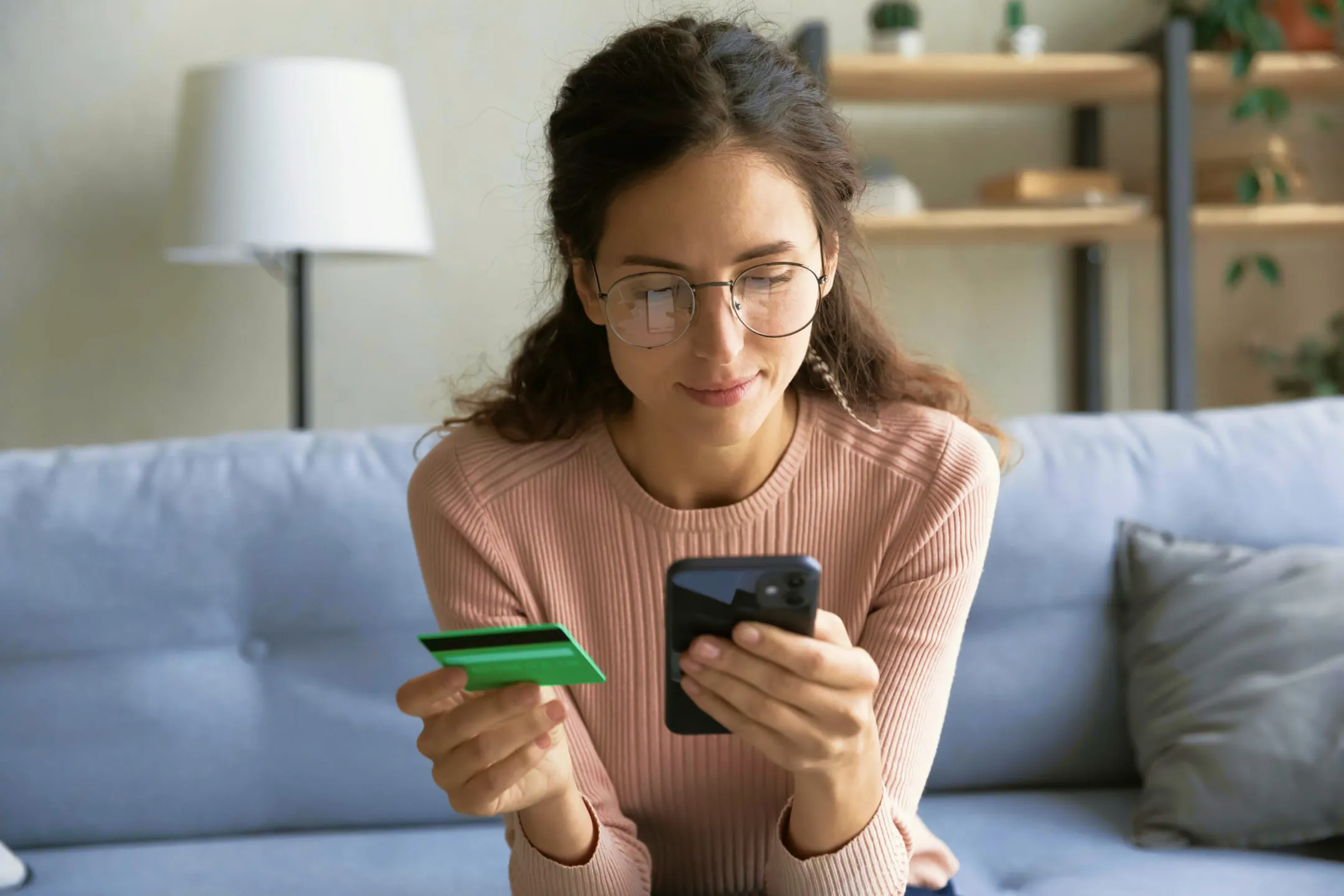 Girl checking bank card details