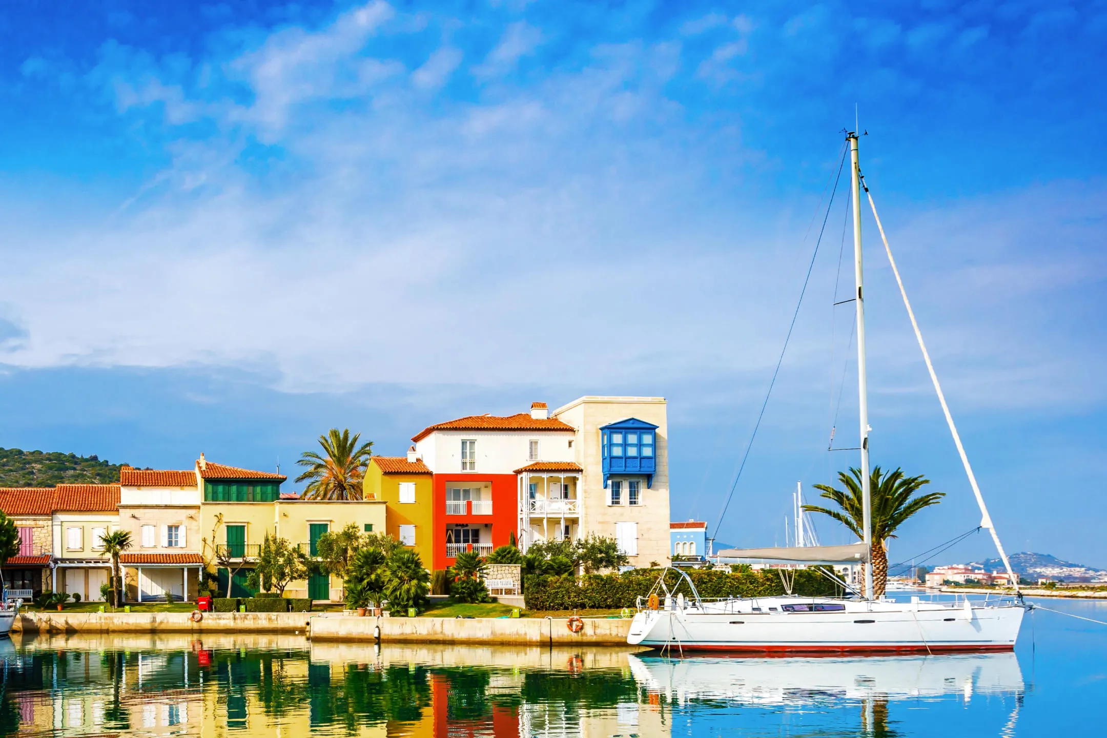 Sailboat near colorful houses
