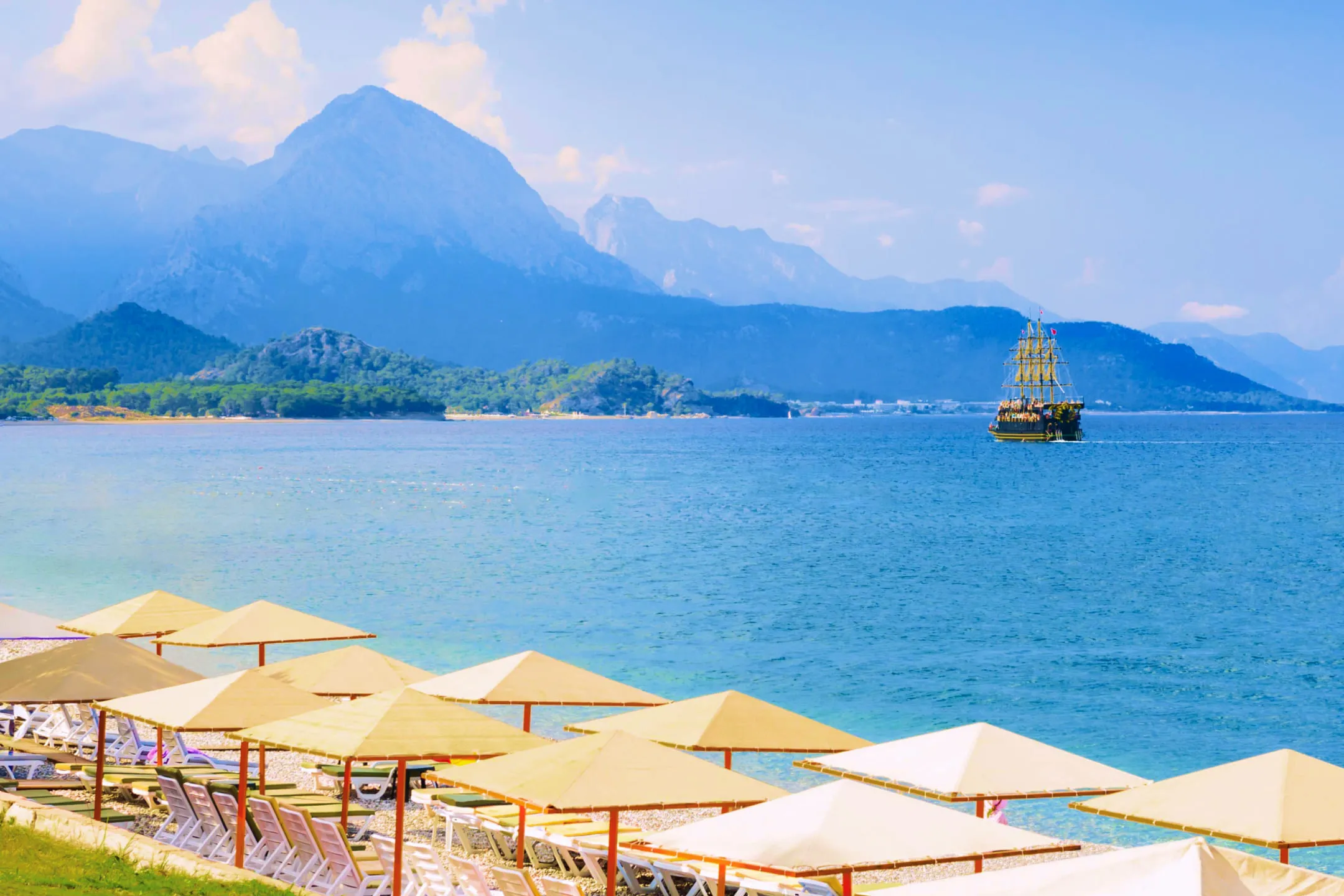 Sailboat heading towards the mountains