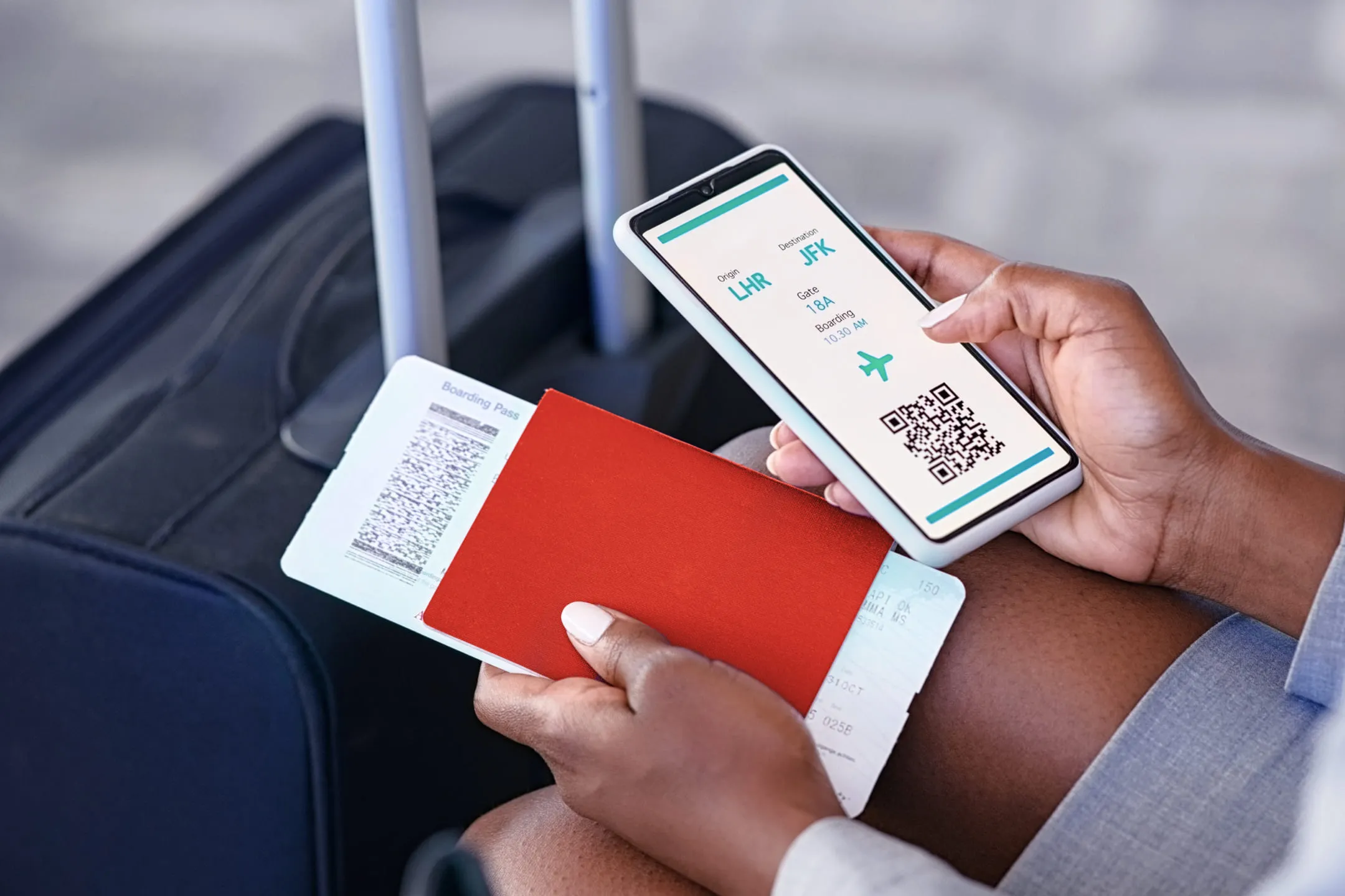 Person holding a phone and passport with a ticket