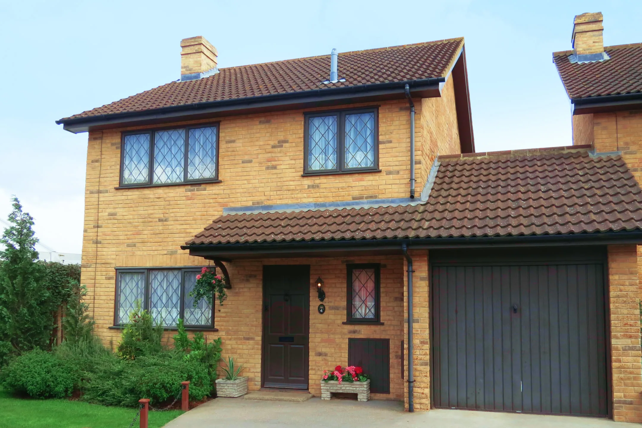 Orange brick house with a garage