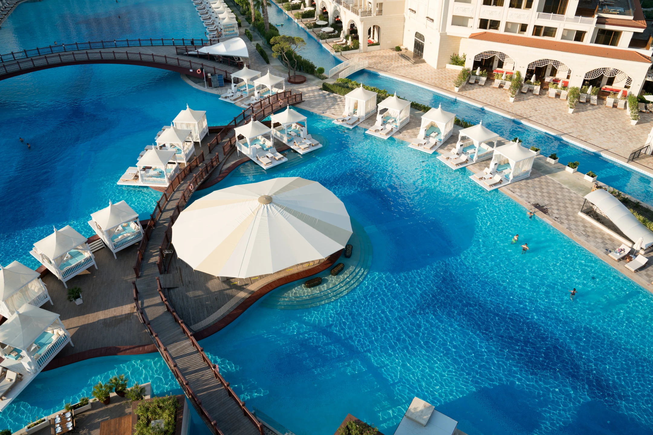 Swimming pool with turquoise water on hotel grounds