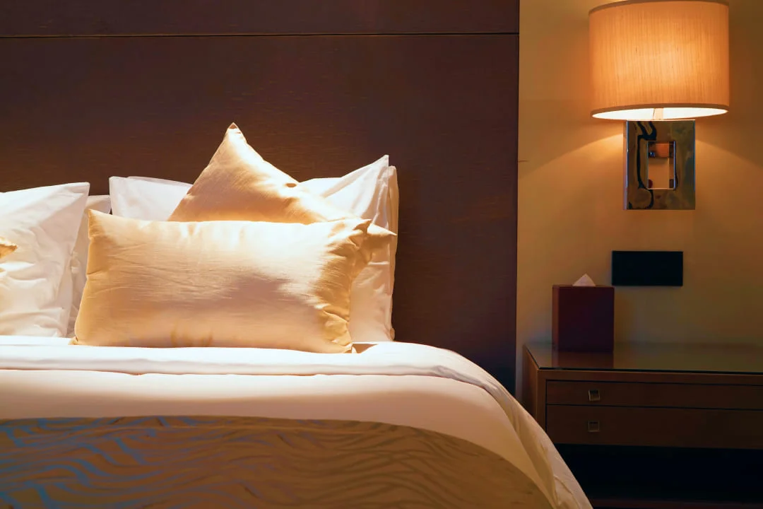 Lamp turned on near the bed