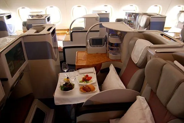 How to get into business class by paying for economy