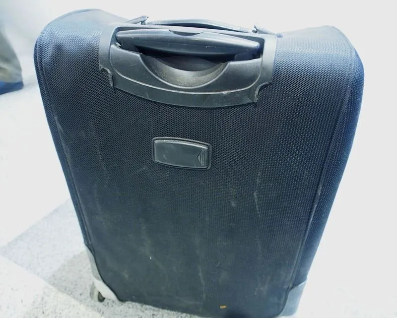 Damaged suitcase at the airport