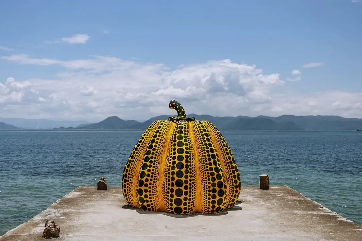 Pumpkin lying on a pier against the sea