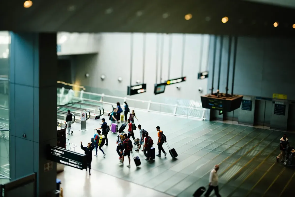 People with suitcases walking in the airport