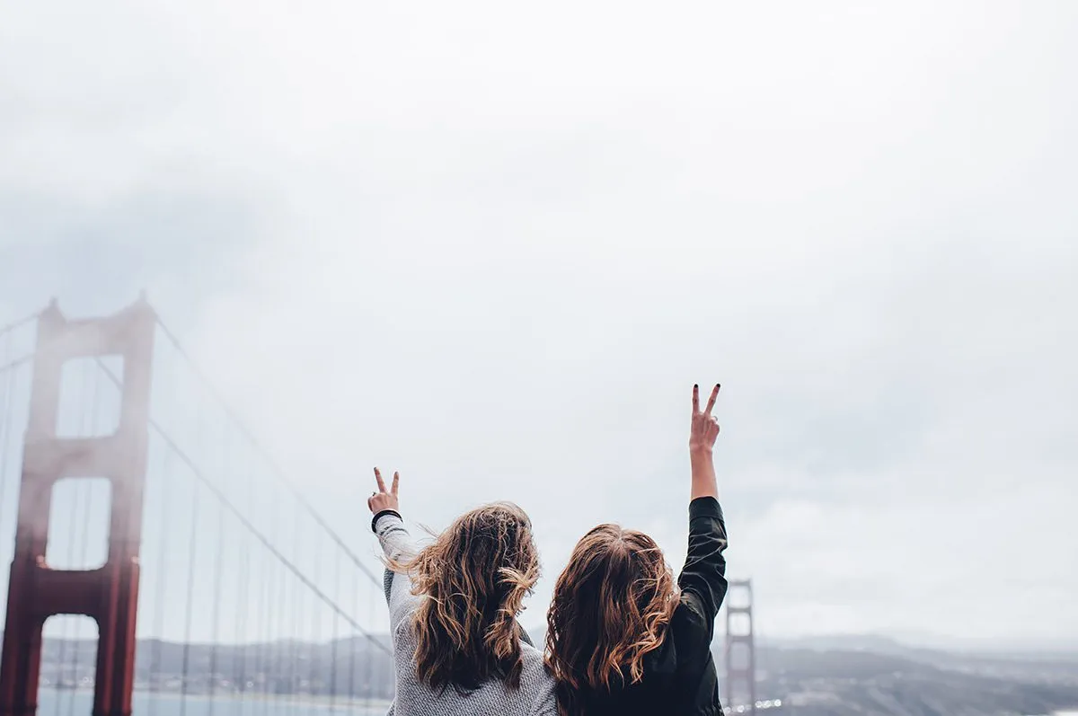 Girls against a bridge background