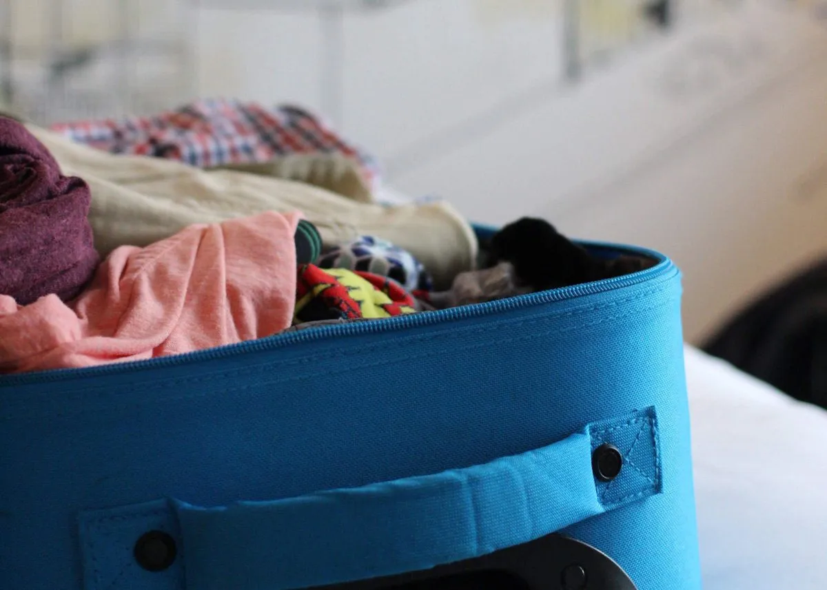 Clothes in a blue suitcase