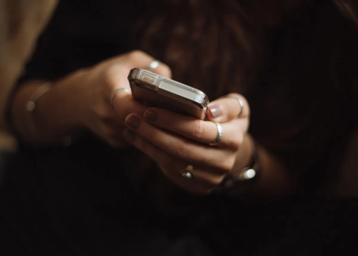 Girl holding a phone in her hands