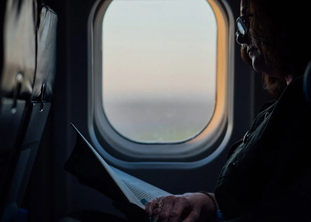 Woman reading a magazine on a plane