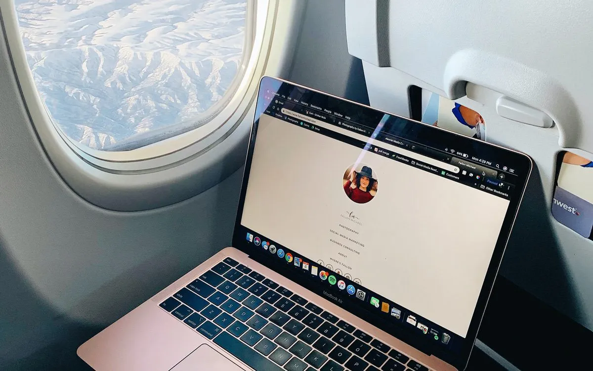 Laptop near an airplane window