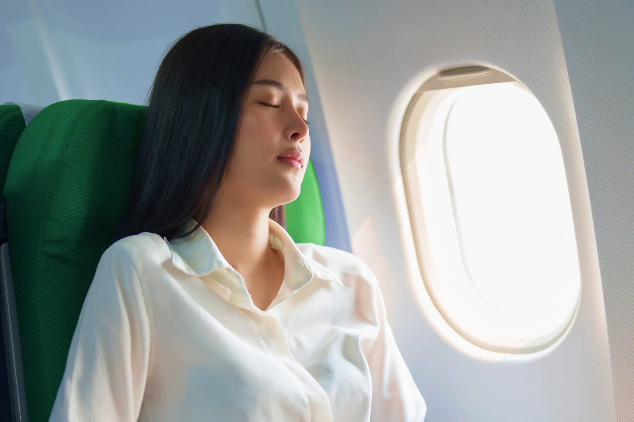 Girl by the airplane window
